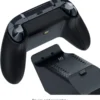 55b0dc7b-75ab-49cb-aebd-15ad4c2d915e Black wireless game controller with a separate charging dock; battery contacts visible on the controller and dock.