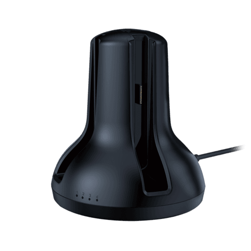 nintendo-switch-el-salvador-next-charging-dock-joycon Black charging dock with a vertical cradle and gold contact pins, connected by a cord; base shows 1–4 status dots.
