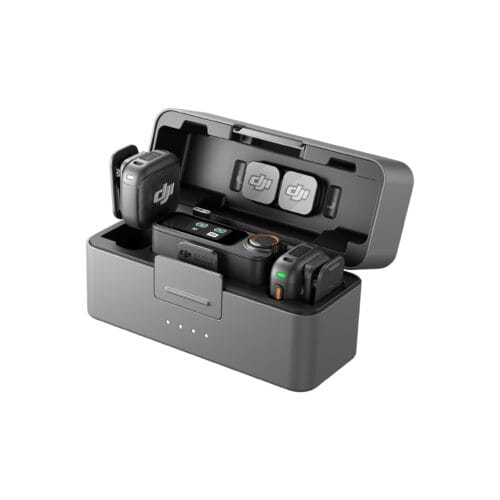 DJI Mic 3 wireless microphone system shown in an open charging case with two transmitters and a receiver inside