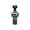 dji-el-salvador-osmo-pocket-4-creator-combo.jpg Handheld gimbal stabilizer with a small camera mounted on top and a touchscreen displaying a mountain landscape—Osmo-style device