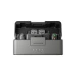 Open DJI carry case interior with two branded controllers visible inside foam compartments