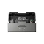 dji-el-salvador-mic-3-sistema-inalambrico-dos-personas.jpg Open DJI carry case interior with two branded controllers visible inside foam compartments