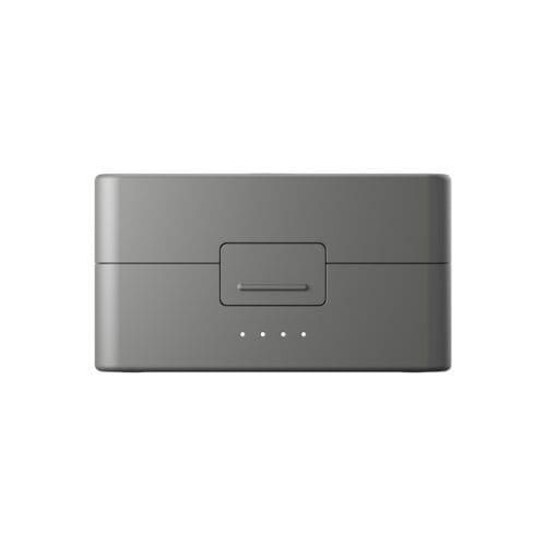 Back view of a gray electronic device showing a recessed latch and a row of five small indicator dots on a smooth, rounded surface