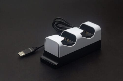 next-accessories-playstation-NXPS5CHRG2-54184590-1-1024x678 (1) Dual-battery USB charger dock with two slots and a black base, connected by a USB cable