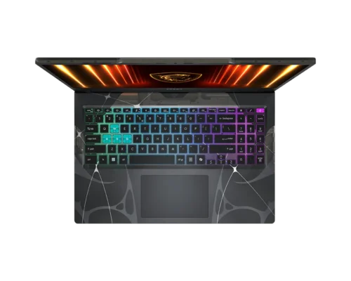 Top-down view of a gaming laptop with a rainbow RGB keyboard and dark patterned palm rest, screen glowing orange.